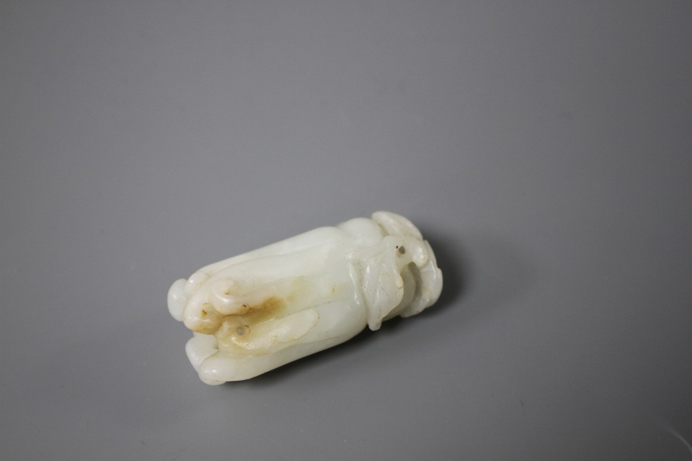 A Chinese jade carving of a finger citron, length 5.5cm, width 2.5cm, depth 2cm